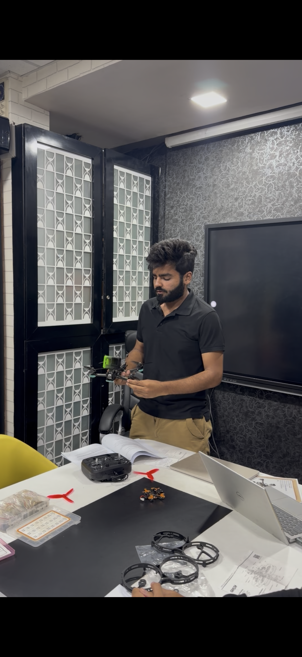 Participant holding a completed drone build